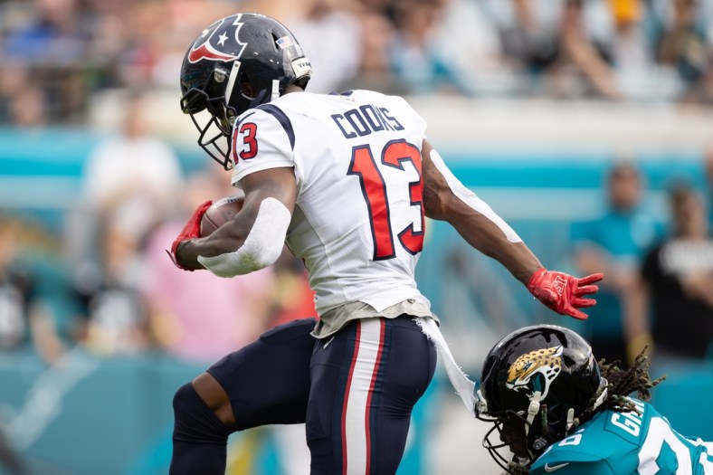 Dec 19, 2021; Jacksonville, Florida, USA; Houston Texans wide receiver Brandin Cooks (13) runs with the ball for a touchdown during the first half against the Jacksonville Jaguars at TIAA Bank Field. Mandatory Credit: Matt Pendleton-USA TODAY Sports