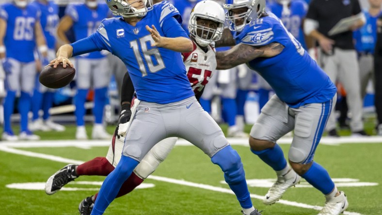 Dec 19, 2021; Detroit, Michigan, USA; Detroit Lions quarterback Jared Goff (16) throws the ball deep against the Arizona Cardinals during the second half at Ford Field. Mandatory Credit: David Reginek-USA TODAY Sports