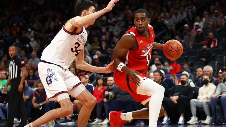 Dec 18, 2021; Phoenix, Arizona, USA; Texas Tech Red Raiders forward Bryson Williams (11) controls the ball against Gonzaga Bulldogs center Chet Holmgren (34) during the Colangelo Classic at Footprint Center. Mandatory Credit: Mark J. Rebilas-USA TODAY Sports