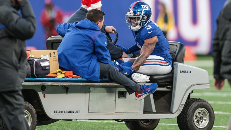 Dec 19, 2021; East Rutherford, New Jersey, USA; New York Giants wide receiver Sterling Shepard (3) is driven off of the field after an injury during the second half against the Dallas Cowboys at MetLife Stadium. Mandatory Credit: Vincent Carchietta-USA TODAY Sports