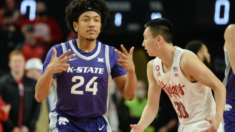 Dec 19, 2021; Lincoln, Nebraska, USA;  Kansas State Wildcats guard Nijel Pack (24) reacts after a three point basket against the Nebraska Cornhuskers in the first half at Pinnacle Bank Arena. Mandatory Credit: Steven Branscombe-USA TODAY Sports