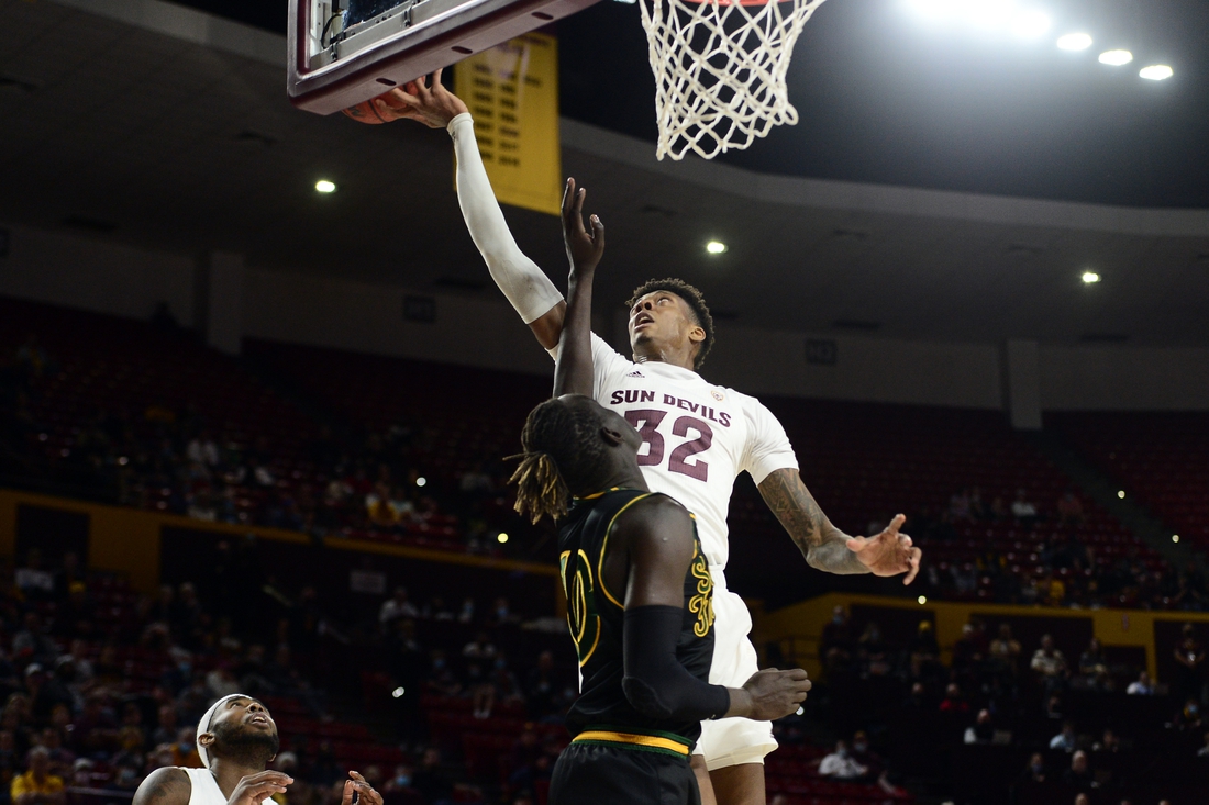 Dec 19, 2021; Tempe, Arizona, USA; Arizona State Sun Devils forward Alonzo Gaffney (32) grabs a rebound over San Francisco Dons forward Josh Kunen (10) during the first half at Desert Financial Arena. Mandatory Credit: Joe Camporeale-USA TODAY Sports