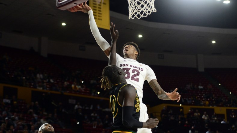 Dec 19, 2021; Tempe, Arizona, USA; Arizona State Sun Devils forward Alonzo Gaffney (32) grabs a rebound over San Francisco Dons forward Josh Kunen (10) during the first half at Desert Financial Arena. Mandatory Credit: Joe Camporeale-USA TODAY Sports