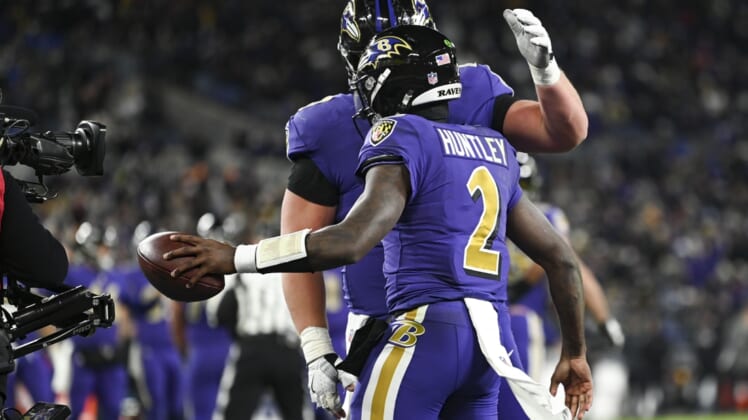 Dec 19, 2021; Baltimore, Maryland, USA;  Baltimore Ravens quarterback Tyler Huntley (2) celebrates with  tight end Mark Andrews (89) after scoring a touchdown  during during the second half against the Green Bay Packersat M&T Bank Stadium. Mandatory Credit: Tommy Gilligan-USA TODAY Sports