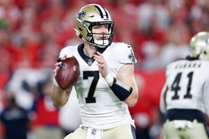 Dec 19, 2021; Tampa, Florida, USA;  New Orleans Saints quarterback Taysom Hill (7) drops back to pass in the first quarter against the Tampa Bay Buccaneers at Raymond James Stadium. Mandatory Credit: Nathan Ray Seebeck-USA TODAY Sports