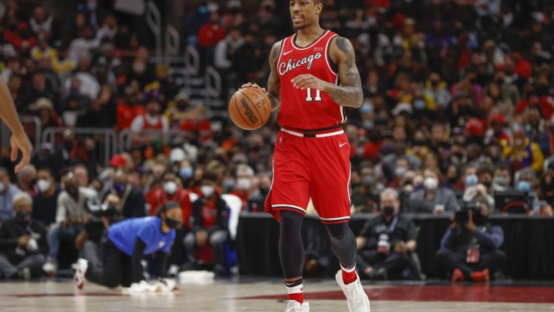 Dec 19, 2021; Chicago, Illinois, USA; Chicago Bulls forward DeMar DeRozan (11) brings the ball up court against the Los Angeles Lakers during the first half at United Center. Mandatory Credit: Kamil Krzaczynski-USA TODAY Sports