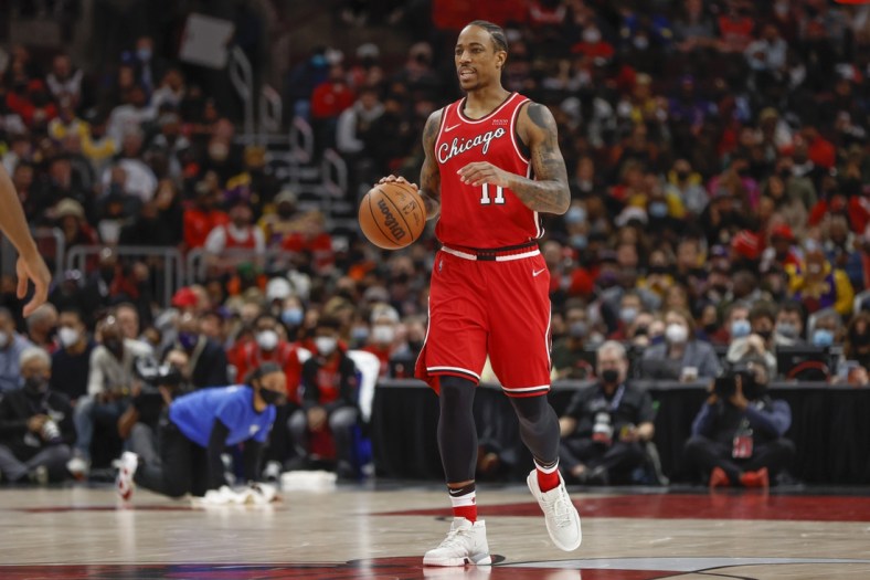 Dec 19, 2021; Chicago, Illinois, USA; Chicago Bulls forward DeMar DeRozan (11) brings the ball up court against the Los Angeles Lakers during the first half at United Center. Mandatory Credit: Kamil Krzaczynski-USA TODAY Sports