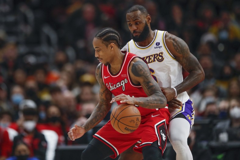 Dec 19, 2021; Chicago, Illinois, USA; Los Angeles Lakers forward LeBron James (6) defends against Chicago Bulls forward DeMar DeRozan (11) during the second half at United Center. Mandatory Credit: Kamil Krzaczynski-USA TODAY Sports