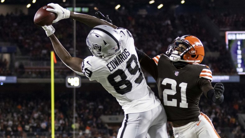 Dec 20, 2021; Cleveland, Ohio, USA; Las Vegas Raiders wide receiver Bryan Edwards (89) makes a touchdown reception in the end zone against Cleveland Browns cornerback Denzel Ward (21) during the first quarter at FirstEnergy Stadium. Mandatory Credit: Scott Galvin-USA TODAY Sports