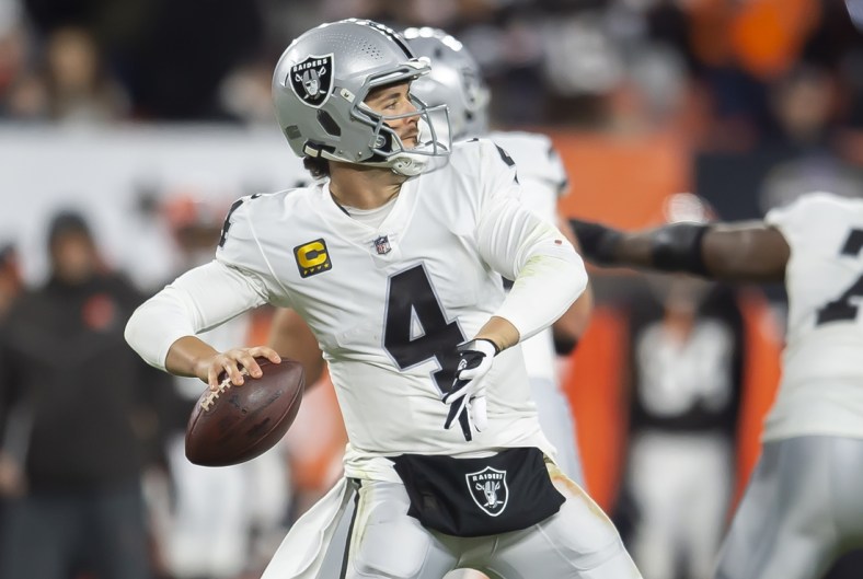 Dec 20, 2021; Cleveland, Ohio, USA; Las Vegas Raiders quarterback Derek Carr (4) throws a pass during the first half against the Cleveland Browns at FirstEnergy Stadium. Mandatory Credit: Ken Blaze-USA TODAY Sports
