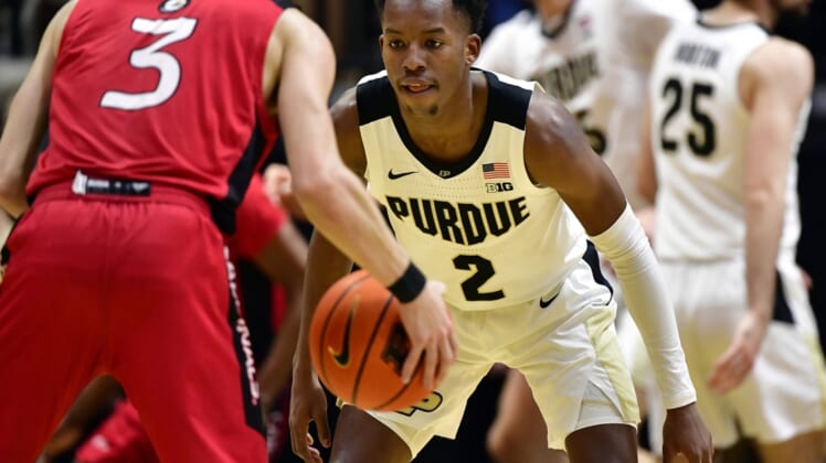 Dec 20, 2021; West Lafayette, Indiana, USA;  Purdue Boilermakers guard Eric Hunter Jr. (2) covers Incarnate Word Cardinals guard Drew Lutz (3) during the second half at Mackey Arena.  Boilermakers won 79-59. Mandatory Credit: Marc Lebryk-USA TODAY Sports