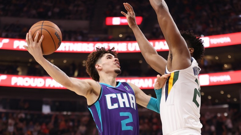 Dec 20, 2021; Salt Lake City, Utah, USA; Charlotte Hornets guard LaMelo Ball (2) shoots the ball on Utah Jazz center Hassan Whiteside (21) during the second quarter at Vivint Arena. Mandatory Credit: Rob Gray-USA TODAY Sports