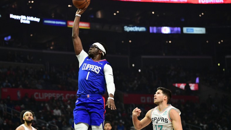 Dec 20, 2021; Los Angeles, California, USA; Los Angeles Clippers guard Reggie Jackson (1) shoots ahead of San Antonio Spurs forward Doug McDermott (17) during the first half at Staples Center. Mandatory Credit: Gary A. Vasquez-USA TODAY Sports