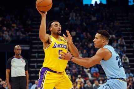Dec 9, 2021; Memphis, Tennessee, USA; Los Angeles Lakers guard Talen Horton-Tucker (5) passes the ball as Memphis Grizzles guard Desmond Bane (22) defends during the first half at FedExForum. Mandatory Credit: Petre Thomas-USA TODAY Sports