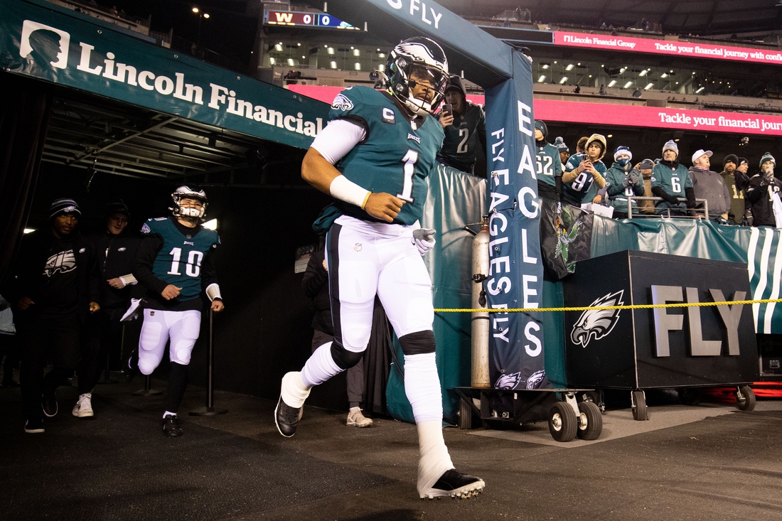 Dec 21, 2021; Philadelphia, Pennsylvania, USA; Philadelphia Eagles quarterbacks Jalen Hurts (1) and Gardner Minshew (10) run out of the tunnel for warmups before the game against the Washington Football Team at Lincoln Financial Field. Mandatory Credit: Bill Streicher-USA TODAY Sports