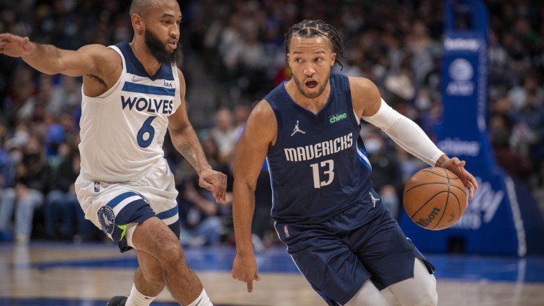 Dec 21, 2021; Dallas, Texas, USA; Dallas Mavericks guard Jalen Brunson (13) brings the ball up court past Minnesota Timberwolves guard Jordan McLaughlin (6) during the second quarter at the American Airlines Center. Mandatory Credit: Jerome Miron-USA TODAY Sports