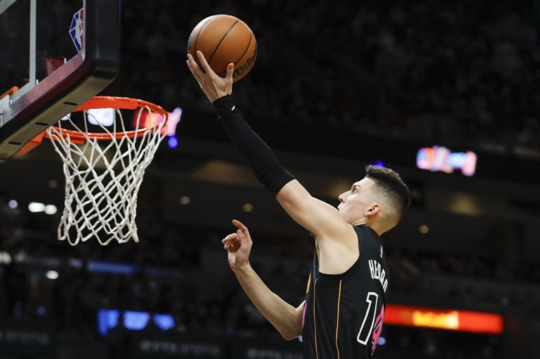 Dec 21, 2021; Miami, Florida, USA; Miami Heat guard Tyler Herro (14) attempts a layup shot against the Indiana Pacers during the second half at FTX Arena. Mandatory Credit: Sam Navarro-USA TODAY Sports