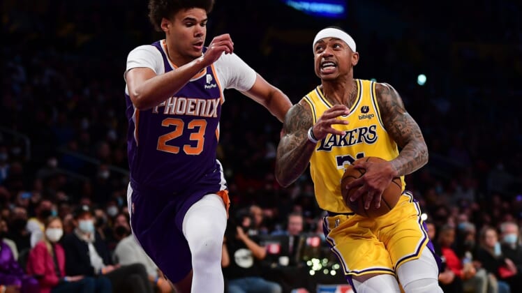 Dec 21, 2021; Los Angeles, California, USA; Los Angeles Lakers guard Isaiah Thomas (31) moves the ball against Phoenix Suns forward Cameron Johnson (23) during the first half at Staples Center. Mandatory Credit: Gary A. Vasquez-USA TODAY Sports