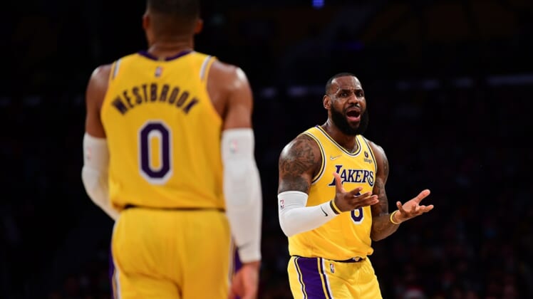Dec 21, 2021; Los Angeles, California, USA; Los Angeles Lakers forward LeBron James (6) reacts after being called for offensive foul against the Phoenix Suns during the first half at Staples Center. Mandatory Credit: Gary A. Vasquez-USA TODAY Sports