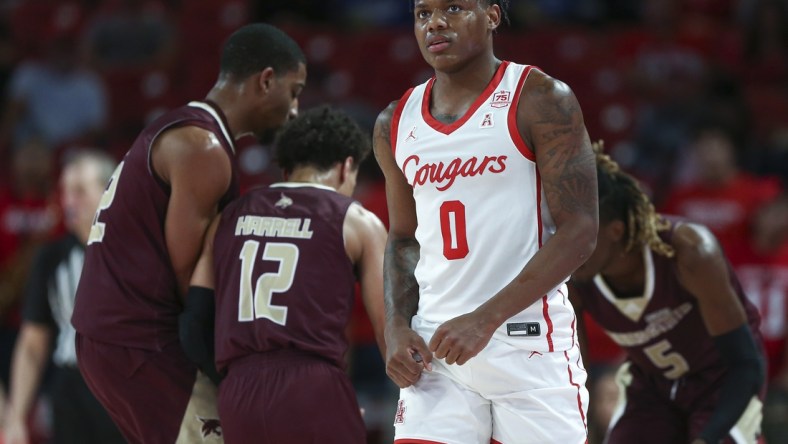 Dec 22, 2021; Houston, Texas, USA; Houston Cougars guard Marcus Sasser (0) reacts after a play during the first half against the Texas State Bobcats at Fertitta Center. Mandatory Credit: Troy Taormina-USA TODAY Sports