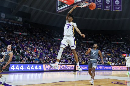 Dec 22, 2021; Baton Rouge, Louisiana, USA;  LSU Tigers forward Alex Fudge (3) dunks the ball against Lipscomb Bisons forward Kaleb Coleman (5) during the first half at Pete Maravich Assembly Center. Mandatory Credit: Stephen Lew-USA TODAY Sports