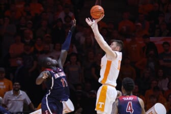 Dec 22, 2021; Knoxville, Tennessee, USA; Tennessee Volunteers forward John Fulkerson (10) shoots the ball against Arizona Wildcats center Oumar Ballo (11) during the second half at Thompson-Boling Arena. Mandatory Credit: Randy Sartin-USA TODAY Sports