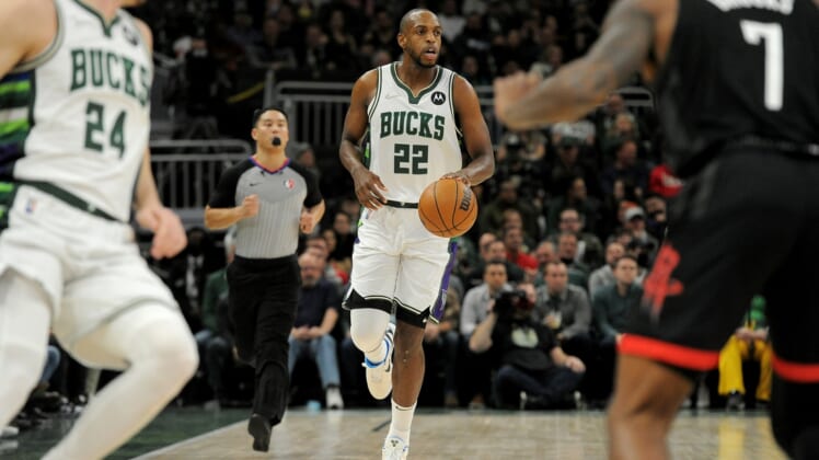 Dec 22, 2021; Milwaukee, Wisconsin, USA;  Milwaukee Bucks forward Khris Middleton (22) brings the ball up court against Houston Rockets int the first half at Fiserv Forum. Mandatory Credit: Michael McLoone-USA TODAY Sports