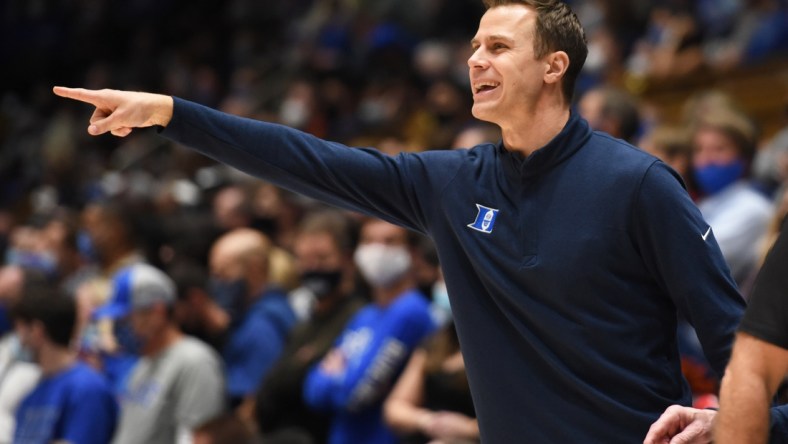 Dec 22, 2021; Durham, North Carolina, USA; Duke Blue Devils associate head coach Jon Scheyer directs the team during the second half against the Virginia Tech Hokies at Cameron Indoor Stadium.  The Blue Devils won 76-65. Mandatory Credit: Rob Kinnan-USA TODAY Sports