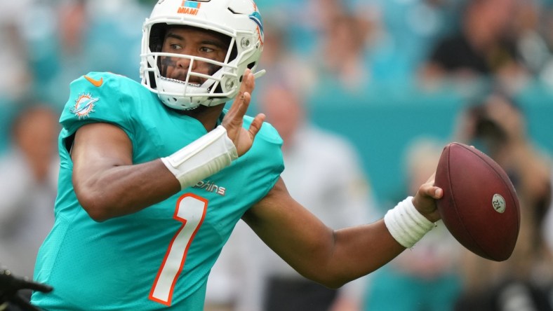 Dec 19, 2021; Miami Gardens, Florida, USA; Miami Dolphins quarterback Tua Tagovailoa (1) attempts a pass against the New York Jets during the second half at Hard Rock Stadium. Mandatory Credit: Jasen Vinlove-USA TODAY Sports