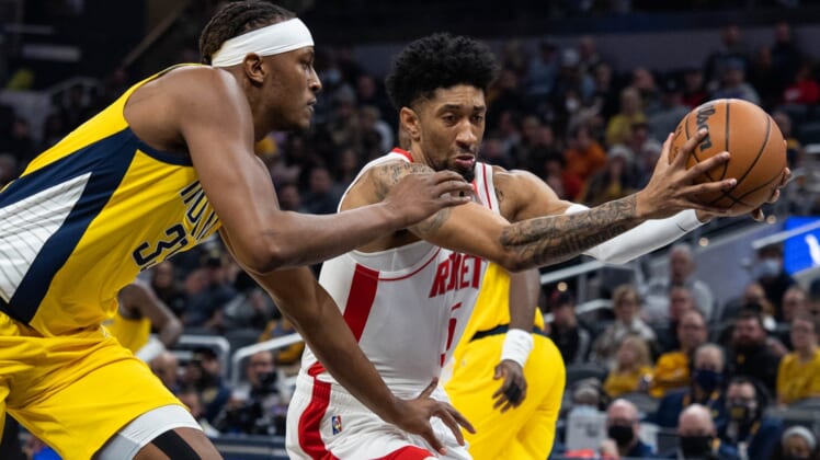 Dec 23, 2021; Indianapolis, Indiana, USA; Houston Rockets center Christian Wood (35) drives to the basket while Indiana Pacers center Myles Turner (33) defends in the first quarter at Gainbridge Fieldhouse. Mandatory Credit: Trevor Ruszkowski-USA TODAY Sports