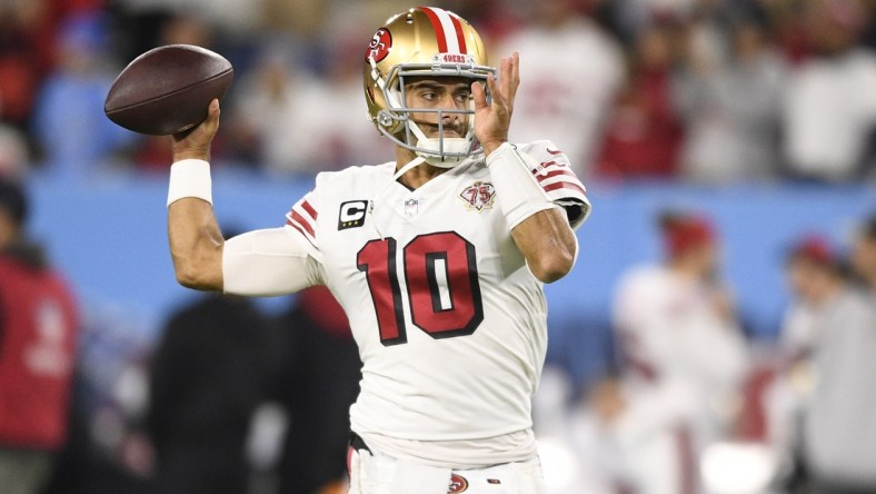 Dec 23, 2021; Nashville, Tennessee, USA;  San Francisco 49ers quarterback Jimmy Garoppolo (10) throws a pass during pre-game warmups before their game against the Tennessee Titans at Nissan Stadium. Mandatory Credit: Steve Roberts-USA TODAY Sports