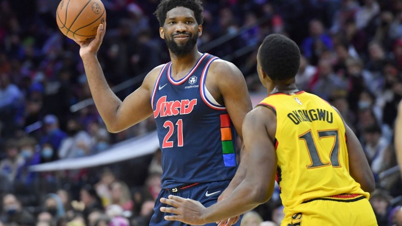 Dec 23, 2021; Philadelphia, Pennsylvania, USA;  Philadelphia 76ers center Joel Embiid (21) is defended by Atlanta Hawks forward Onyeka Okongwu (17) during the third quarter at Wells Fargo Center. Mandatory Credit: Eric Hartline-USA TODAY Sports