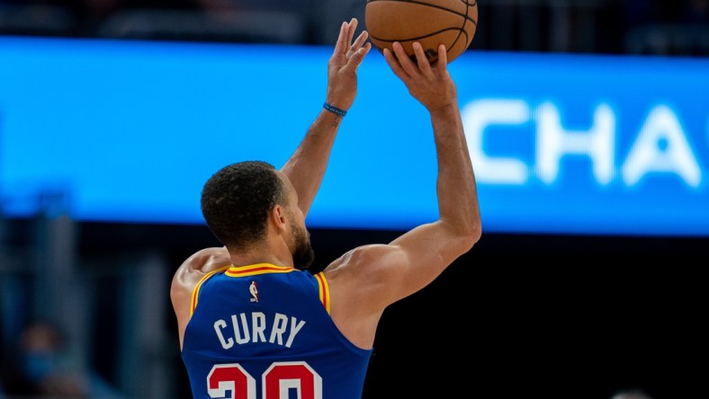 Dec 23, 2021; San Francisco, California, USA; Golden State Warriors guard Stephen Curry (30) shoots a three-point basket during the third quarter against the Memphis Grizzlies at Chase Center. Mandatory Credit: Neville E. Guard-USA TODAY Sports