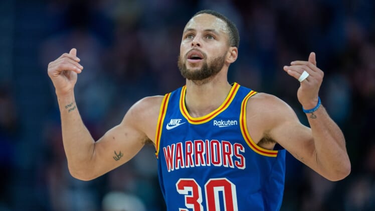 Dec 23, 2021; San Francisco, California, USA; Golden State Warriors guard Stephen Curry (30) celebrates after a basket during the fourth quarter against the Memphis Grizzlies at Chase Center. Mandatory Credit: Neville E. Guard-USA TODAY Sports
