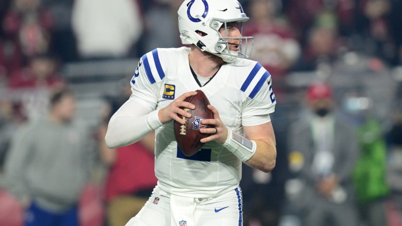 Dec 25, 2021; Glendale, Arizona, USA; Indianapolis Colts quarterback Carson Wentz (2) drops back to pass against the Arizona Cardinals during the first half at State Farm Stadium. Mandatory Credit: Joe Camporeale-USA TODAY Sports