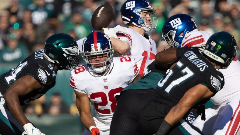 Dec 26, 2021; Philadelphia, Pennsylvania, USA; Philadelphia Eagles defensive end Josh Sweat (94) knocks the ball away from the pass attempt of New York Giants quarterback Jake Fromm (17) during the first quarter at Lincoln Financial Field. Mandatory Credit: Bill Streicher-USA TODAY Sports