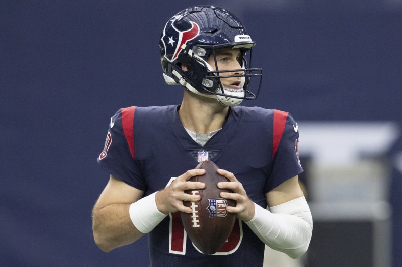 Dec 26, 2021; Houston, Texas, USA;  Houston Texans quarterback Davis Mills (10) drops back to pass against the Los Angeles Chargers in the second quarter at NRG Stadium. Mandatory Credit: Thomas Shea-USA TODAY Sports