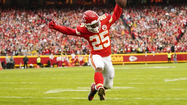 Dec 26, 2021; Kansas City, Missouri, USA; Kansas City Chiefs running back Clyde Edwards-Helaire (25) runs for a touchdown against the Pittsburgh Steelers during the first half at GEHA Field at Arrowhead Stadium. Mandatory Credit: Jay Biggerstaff-USA TODAY Sports