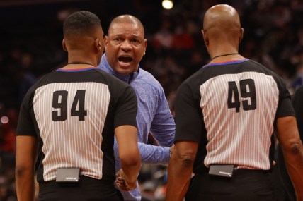 Dec 26, 2021; Washington, District of Columbia, USA; Philadelphia 76ers head coach Doc Rivers argues with referees Jamahl Ralls (94) and Tom Washington (49) during a timeout against the Washington Wizards during the second quarter at Capital One Arena. Mandatory Credit: Geoff Burke-USA TODAY Sports
