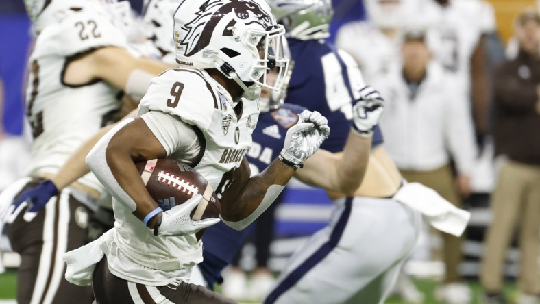 Dec 27, 2021; Detroit, MI, USA; Western Michigan Broncos running back Sean Tyler (9) returns a kickoff for a touchdown in the first half against the Nevada Wolf Pack during the 2021 Quick Lane Bowl at Ford Field. Mandatory Credit: Rick Osentoski-USA TODAY Sports