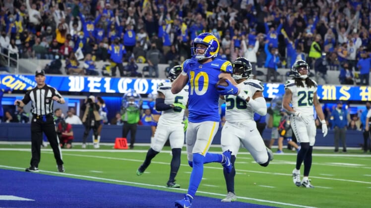 Dec 21, 2021; Inglewood, California, USA; Los Angeles Rams wide receiver Cooper Kupp (10) celebrates after scoring on a 29-yard touchdown reception against the Seattle Seahawks in the second half at SoFi Stadium. The Rams defeated the Seahawks 20-10. Mandatory Credit: Kirby Lee-USA TODAY Sports