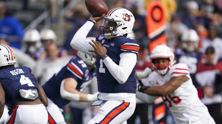 Dec 28, 2021; Birmingham, Alabama, USA; Auburn Tigers quarterback TJ Finley (1) passes against the Houston Cougars during the first half of the 2021 Birmingham Bowl at Protective Stadium. Mandatory Credit: Marvin Gentry-USA TODAY Sports