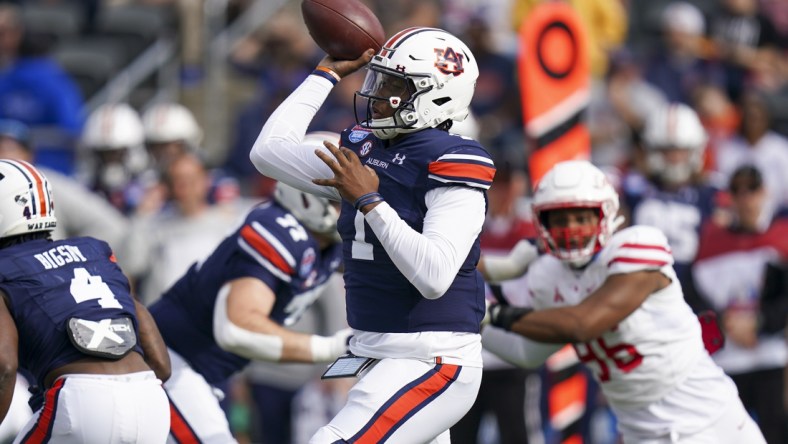 Dec 28, 2021; Birmingham, Alabama, USA; Auburn Tigers quarterback TJ Finley (1) passes against the Houston Cougars during the first half of the 2021 Birmingham Bowl at Protective Stadium. Mandatory Credit: Marvin Gentry-USA TODAY Sports