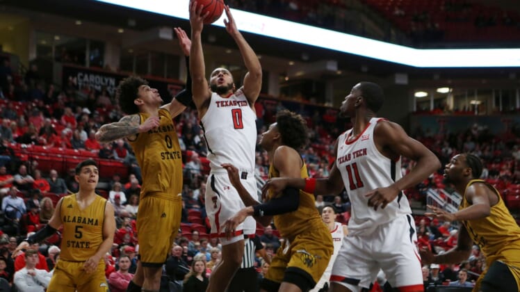 Dec 28, 2021; Lubbock, Texas, USA; Texas Tech Red Raiders forward Kevin Obanor (0) goes to the basket against Alabama State Hornets forward Trace Young (0) in the first half at United Supermarkets Arena. Mandatory Credit: Michael C. Johnson-USA TODAY Sports