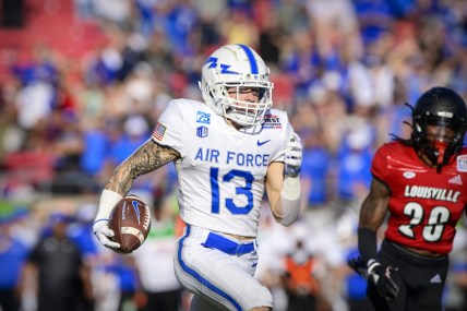Dec 28, 2021; Dallas, Texas, USA; Air Force Falcons wide receiver Brandon Lewis (13) runs for his first of two touchdowns against the Louisville Cardinals during the first half during the 2021 First Responder Bowl at Gerald J. Ford Stadium. Mandatory Credit: Jerome Miron-USA TODAY Sports