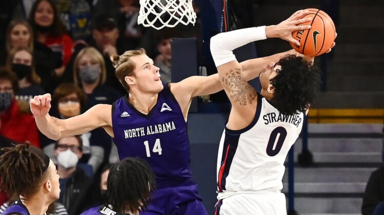 Dec 28, 2021; Spokane, Washington, USA; Gonzaga Bulldogs guard Julian Strawther (0) shoots the ball against North Alabama Lion's forward Payton Youngblood (14) in the first half at McCarthey Athletic Center. Mandatory Credit: James Snook-USA TODAY Sports