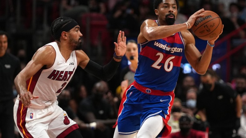 Dec 28, 2021; Miami, Florida, USA; Washington Wizards guard Spencer Dinwiddie (26) passes the ball away from Miami Heat guard Gabe Vincent (2) during the first half at FTX Arena. Mandatory Credit: Jasen Vinlove-USA TODAY Sports