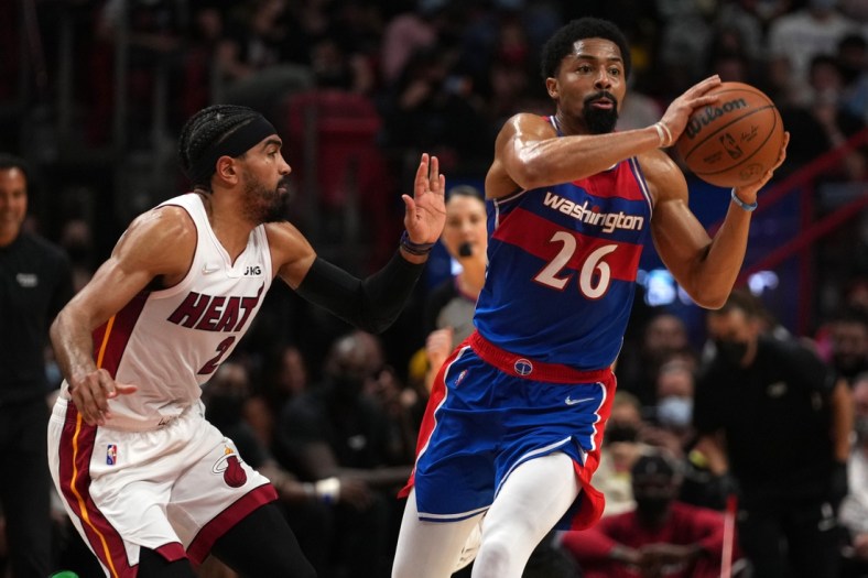 Dec 28, 2021; Miami, Florida, USA; Washington Wizards guard Spencer Dinwiddie (26) passes the ball away from Miami Heat guard Gabe Vincent (2) during the first half at FTX Arena. Mandatory Credit: Jasen Vinlove-USA TODAY Sports