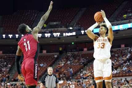 Dec 28, 2021; Austin, Texas, USA; Texas Longhorns forward Tre Mitchell (33) shoots over Incarnate Word Cardinals forward Johnny Hughes (11) during the first half at Frank C. Erwin Jr. Center. Mandatory Credit: Scott Wachter-USA TODAY Sports