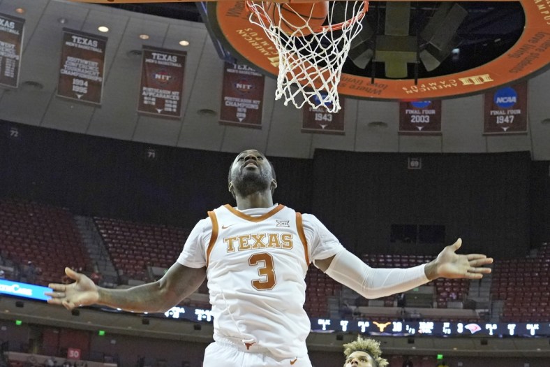 Dec 28, 2021; Austin, Texas, USA; Texas Longhorns guard Courtney Ramey (3) reacts after dunking during the first half against the Incarnate Word Cardinals at Frank C. Erwin Jr. Center. Mandatory Credit: Scott Wachter-USA TODAY Sports